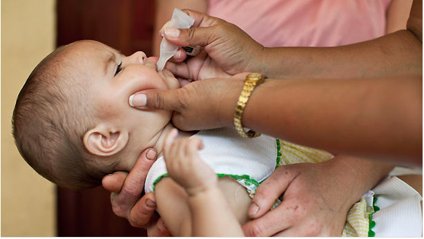 Baby taking rotavirus vaccine